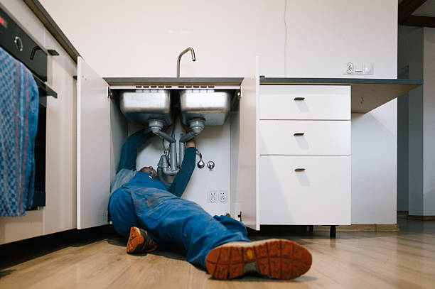 Professional Drain Cleaning technician working in Armington, IL